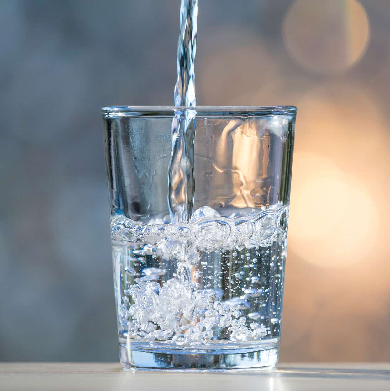 Fresh mineral water being poured into a glass